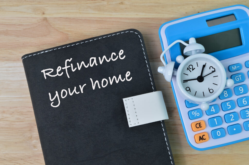 A notebook that says "refinance your home"